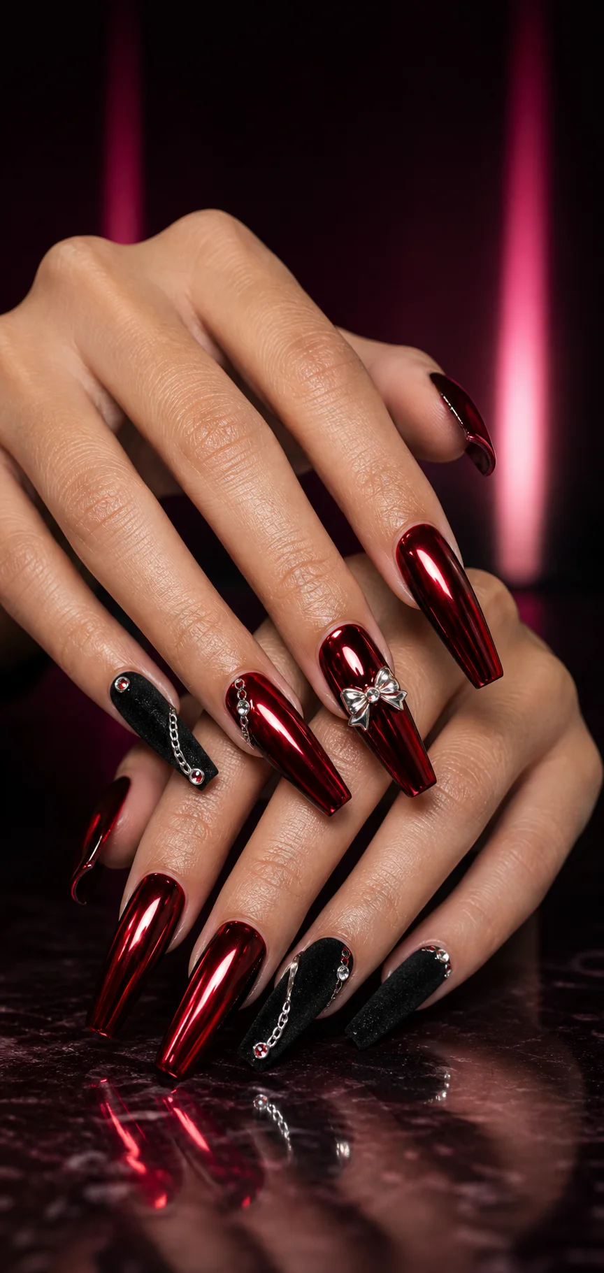Deep cherry chrome nails with black velvet accents